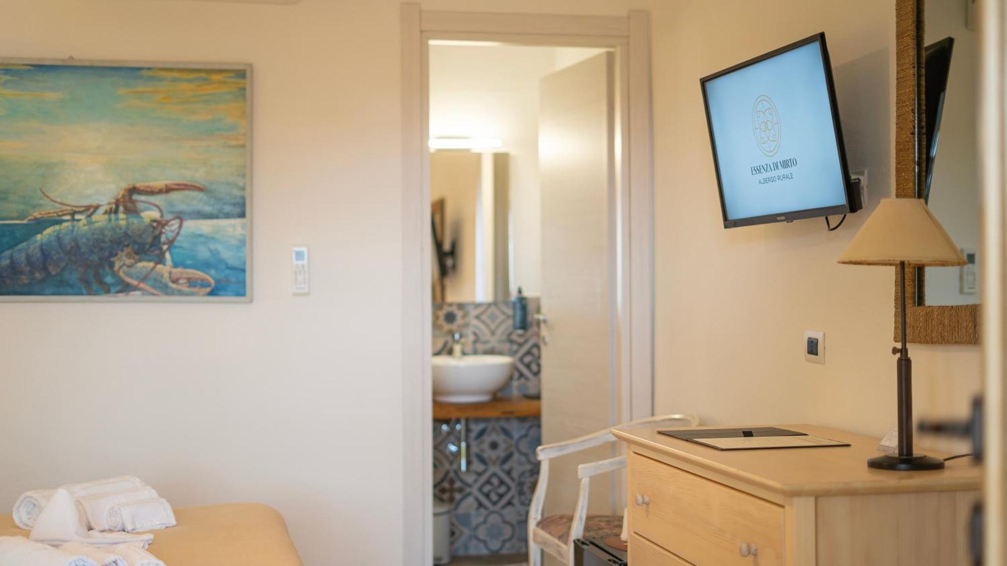Hotel Essenza Di Mirto La Caletta Habitación foto
