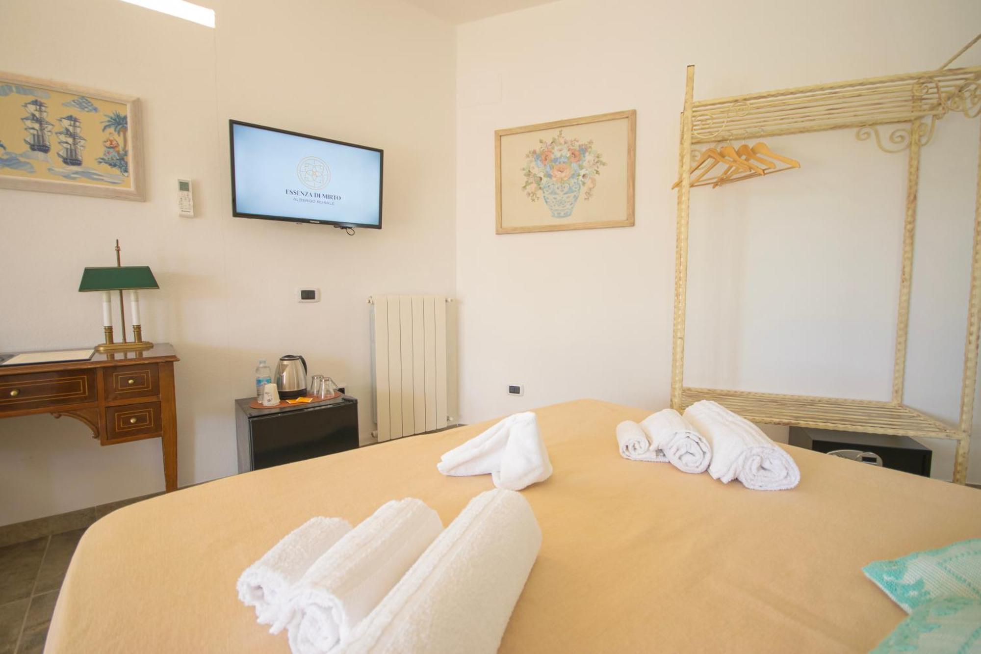 Hotel Essenza Di Mirto La Caletta Habitación foto
